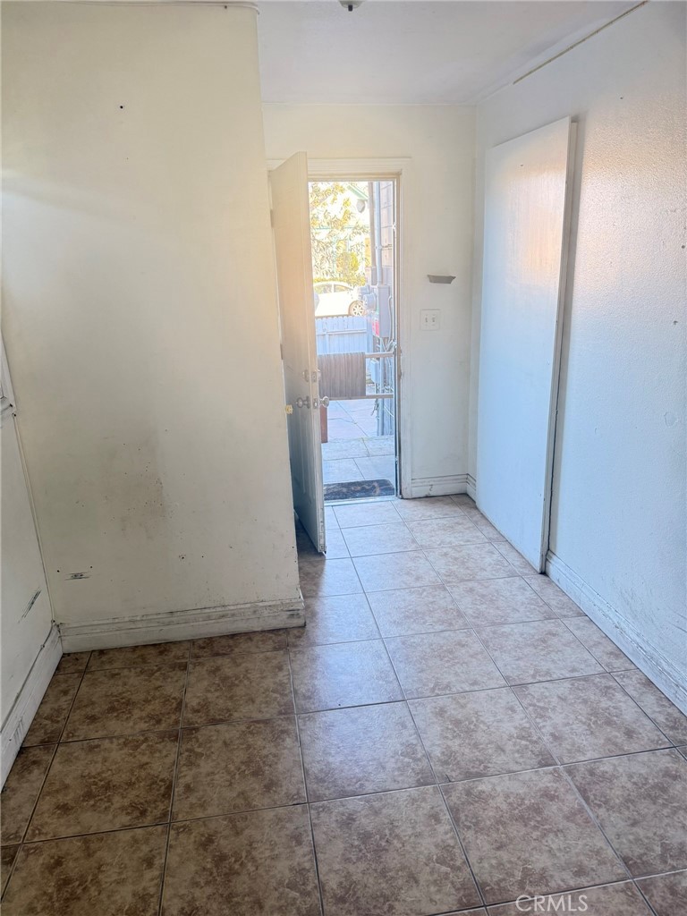 3881 Eucalyptus Avenue, Unit 3 Riverside, CA 92507 - Photo 5 of 5 an empty room with a empty space and windows