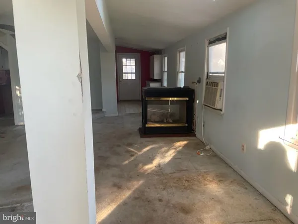 a view of livingroom with furniture and windows