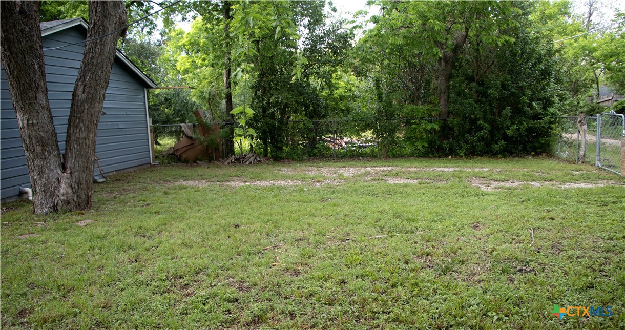 1407 South 7th Street Temple, TX 76504 - Photo 36 of 36 a view of a backyard with large trees