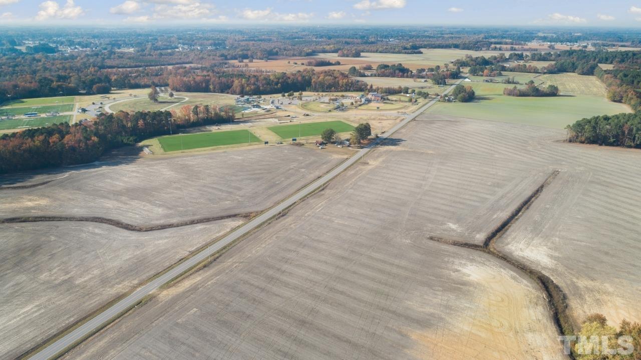0 London Church Road Elm City, NC 27822 - Photo 19 of 28 an aerial view of a house with a lake view