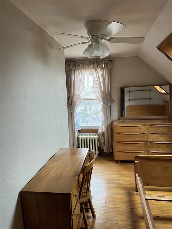 22 Commonwealth Avenue Worcester, MA 01604 - Photo 17 of 23 a bedroom with a bed and a chandelier