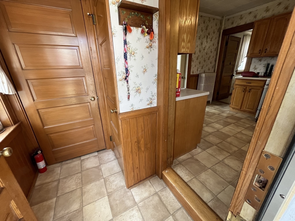22 Commonwealth Avenue Worcester, MA 01604 - Photo 10 of 23 a view of a door and an empty room with wooden floor