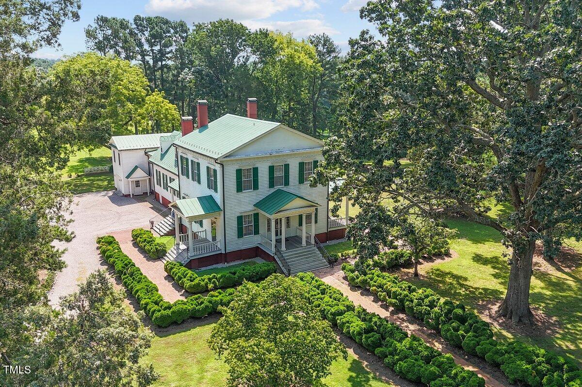206 Shaver Road Macon, NC 27551 - Photo 58 of 68 an aerial view of a house with a big yard and large trees