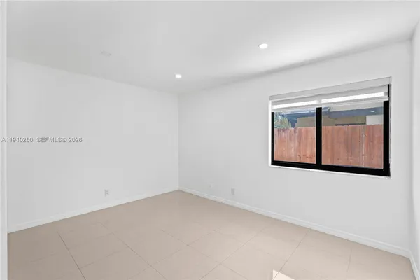a view of an empty room with cabinet