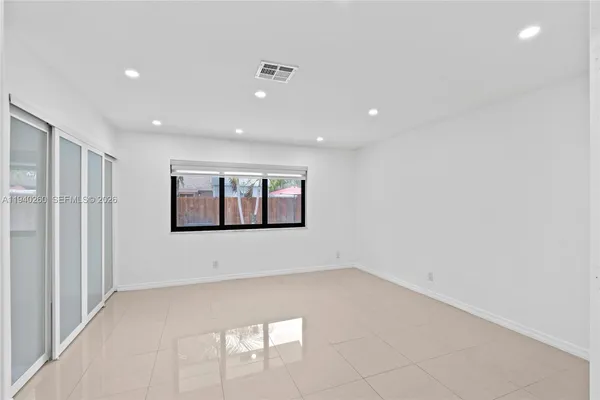a view of an empty room with a window