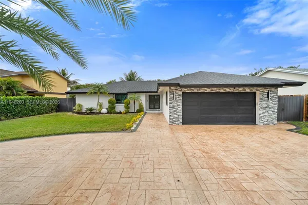 a view of a chairs and table in the patio