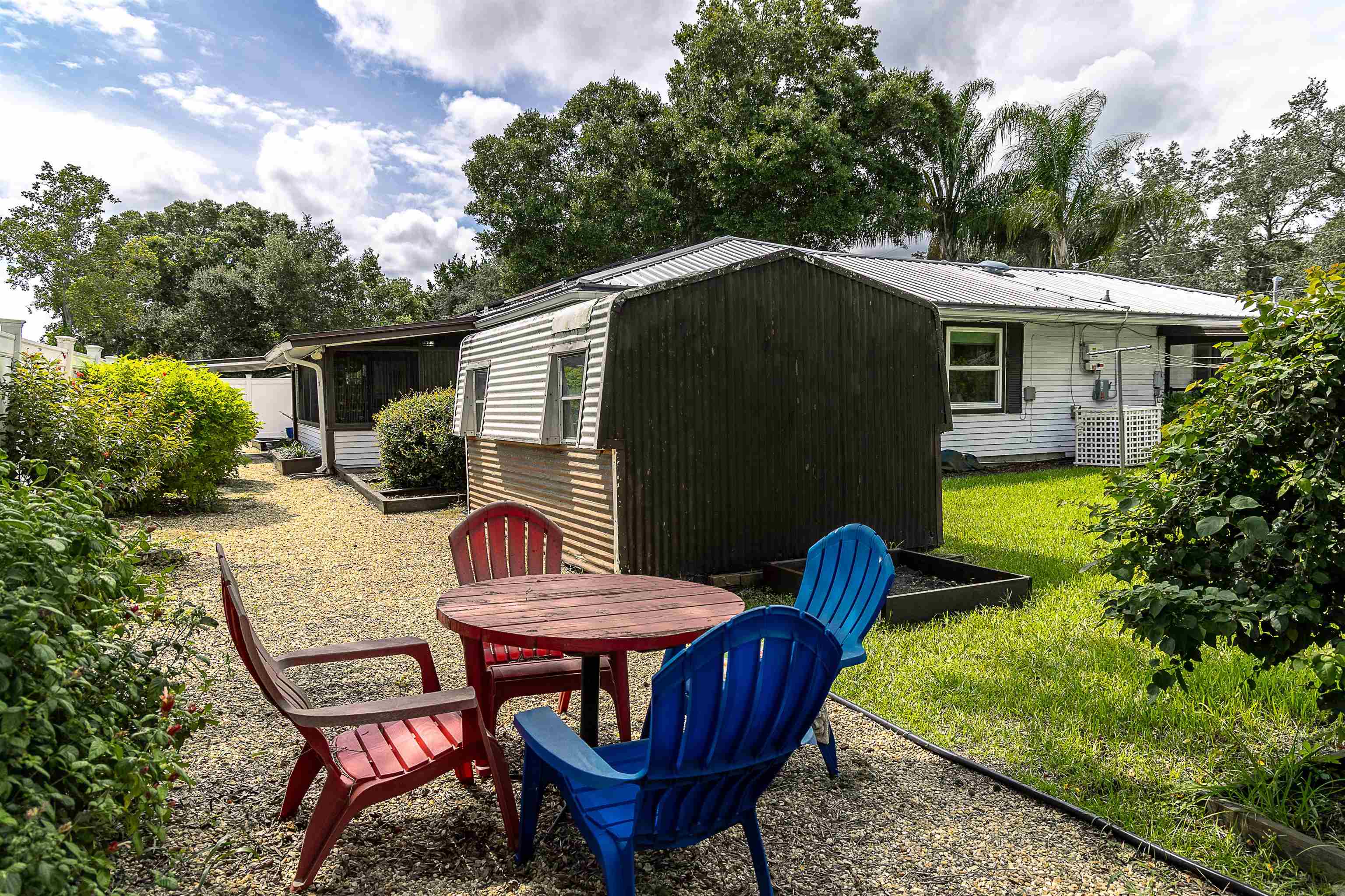 357 Orchis Road St. Augustine, FL 32086 - Photo 11 of 54 a backyard of a house with table and chairs