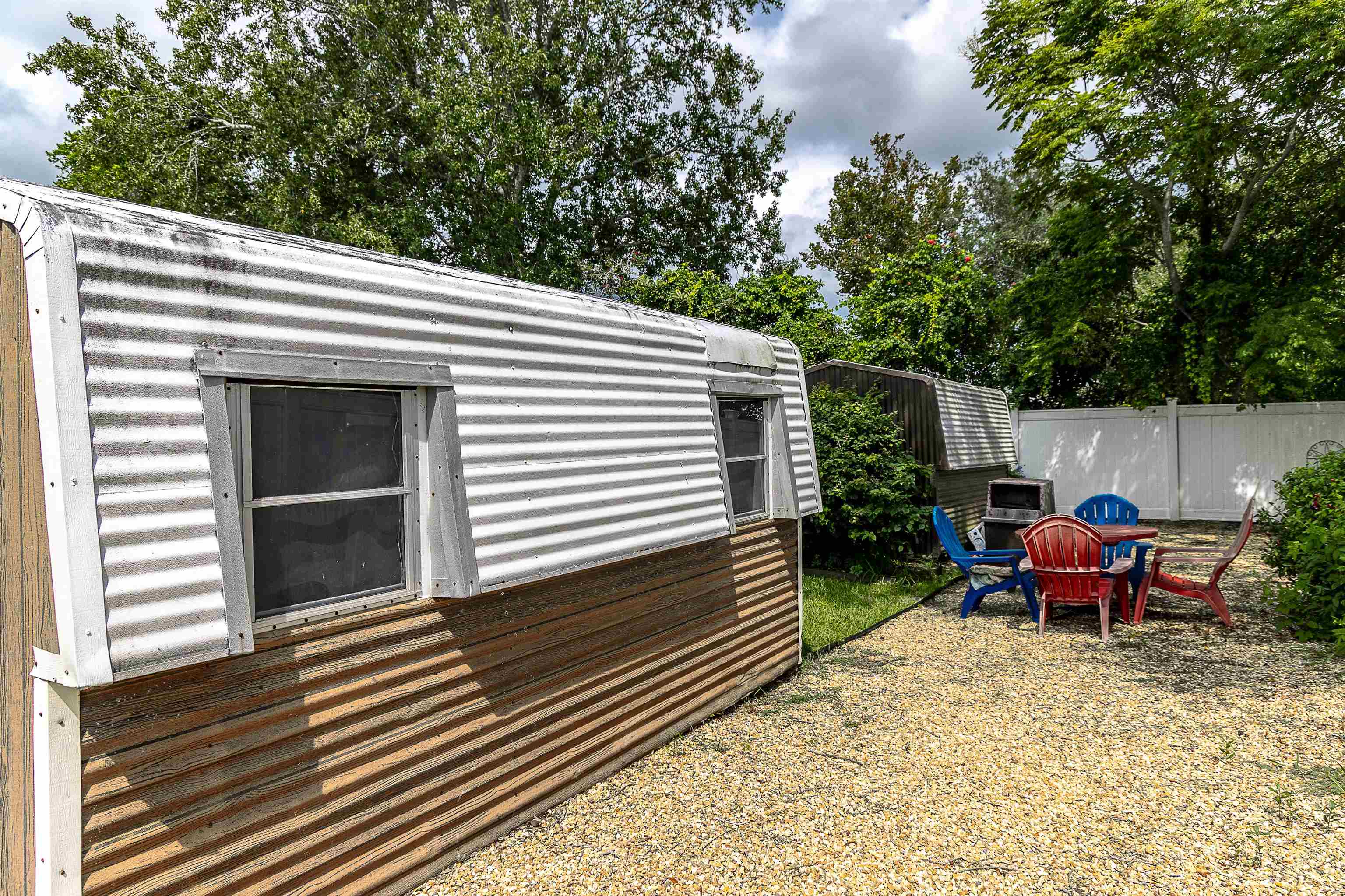 357 Orchis Road St. Augustine, FL 32086 - Photo 12 of 54 a backyard of a house with outdoor seating