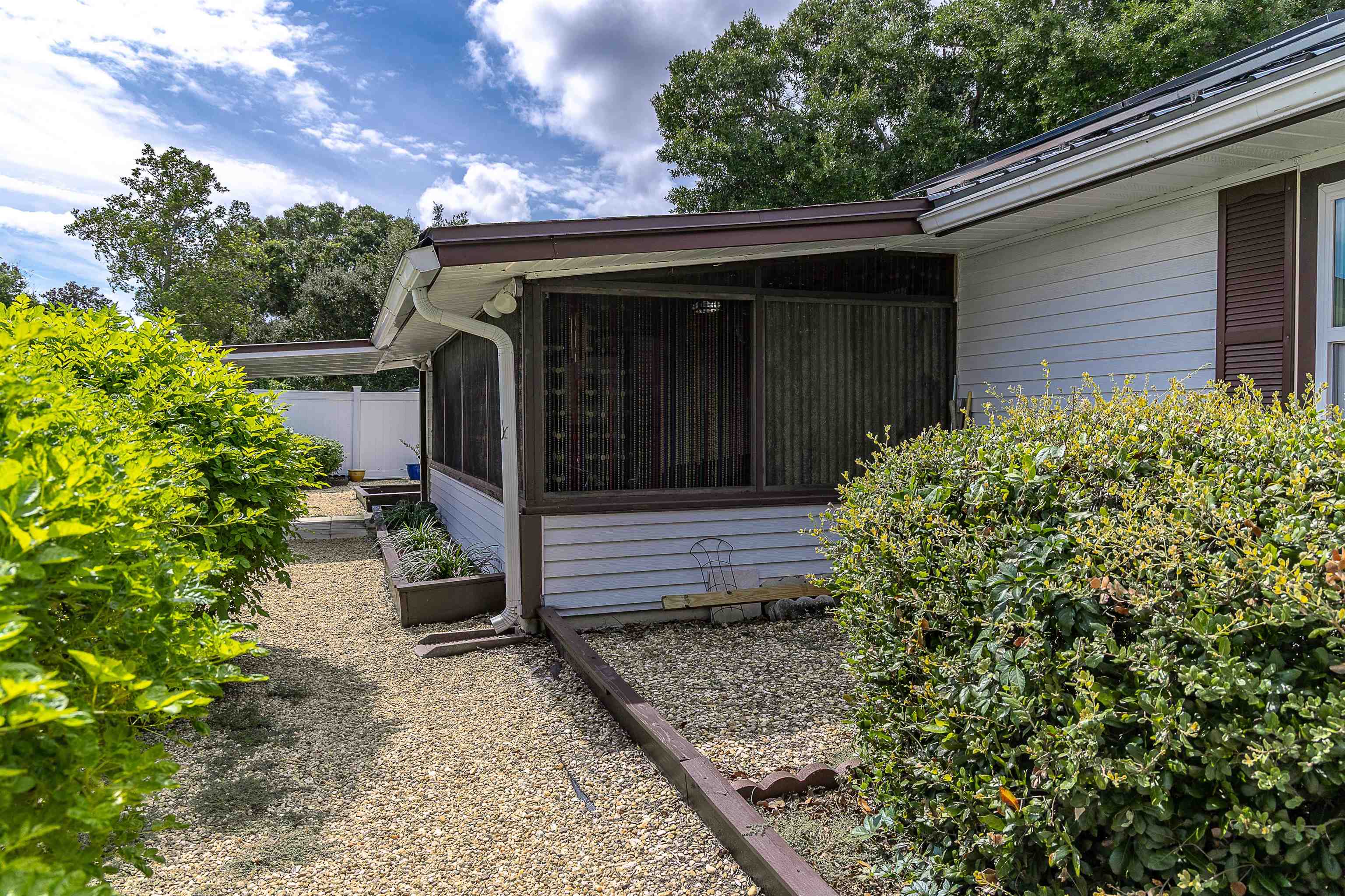 357 Orchis Road St. Augustine, FL 32086 - Photo 13 of 54 a front view of a house with a garden