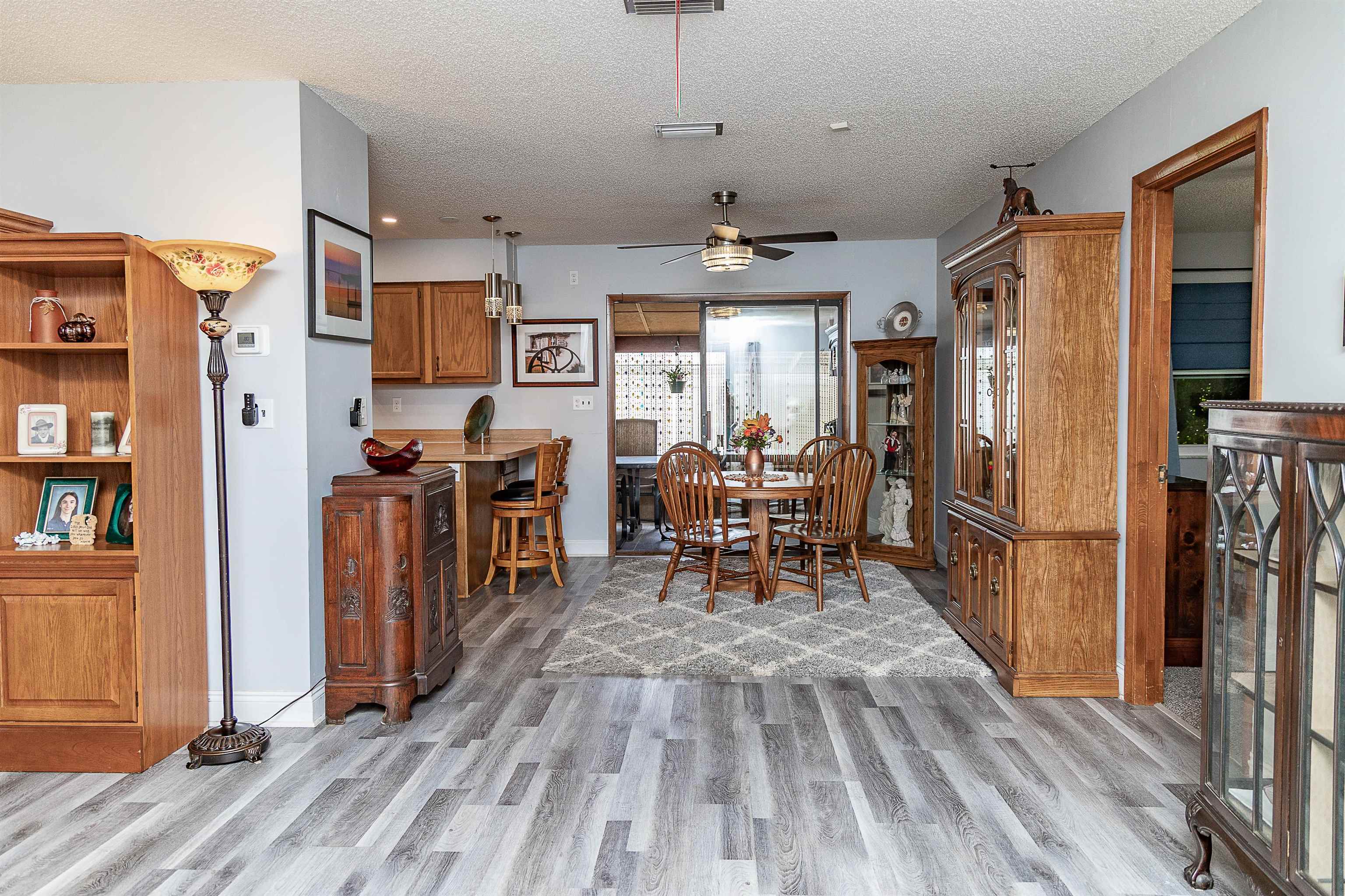 357 Orchis Road St. Augustine, FL 32086 - Photo 17 of 54 a view of a kitchen with dining room and wooden floor