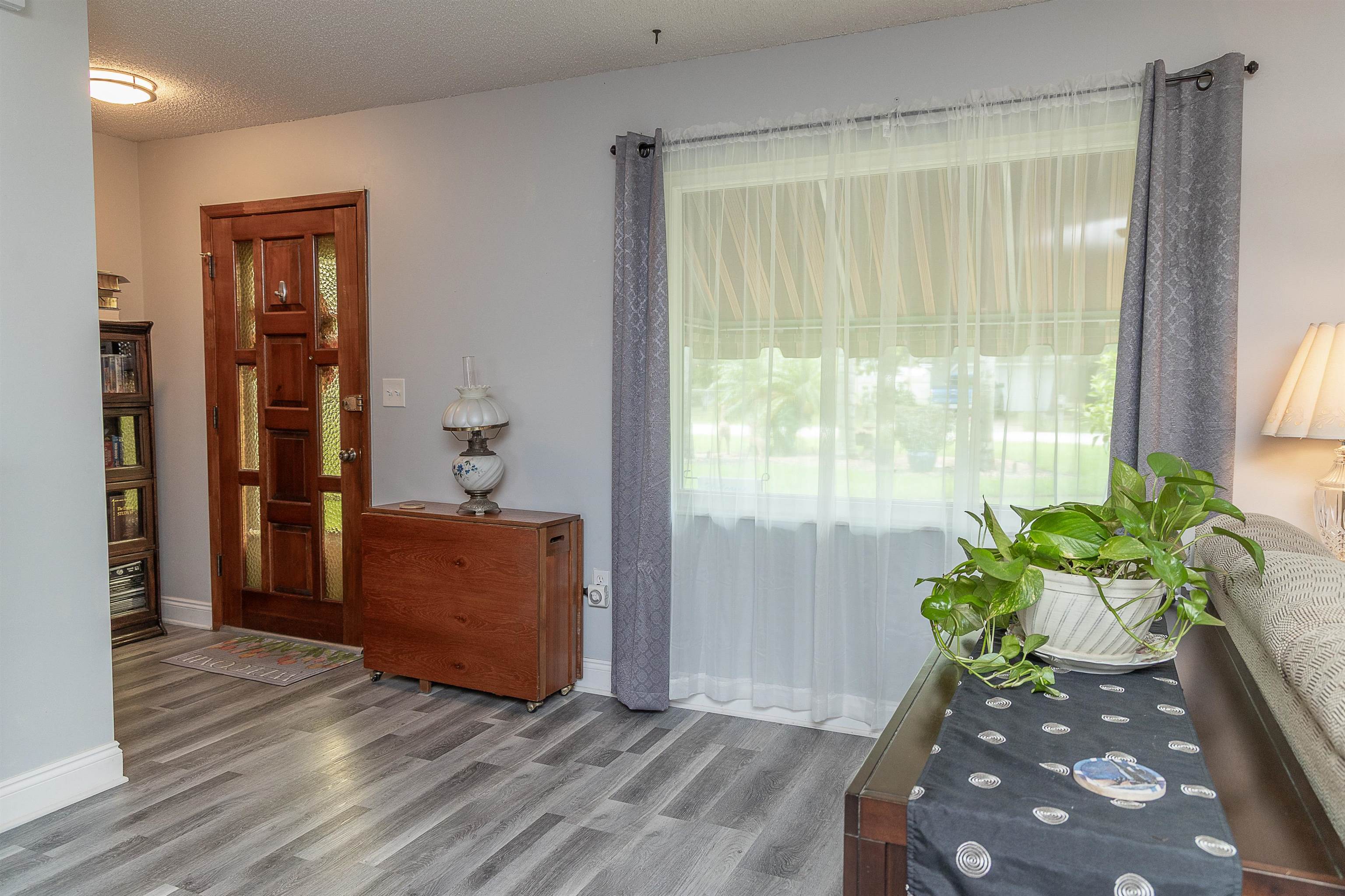 357 Orchis Road St. Augustine, FL 32086 - Photo 18 of 54 a living room with furniture and a potted plant
