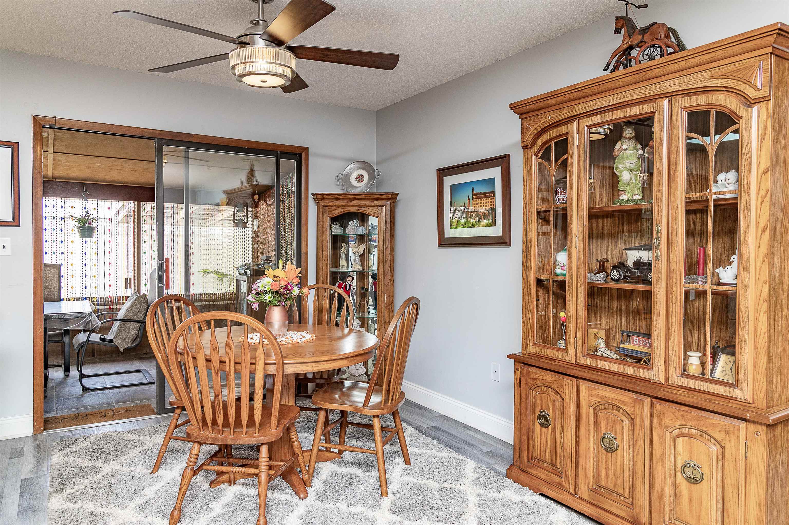 357 Orchis Road St. Augustine, FL 32086 - Photo 24 of 54 a dining room with furniture a chandelier and wooden floor