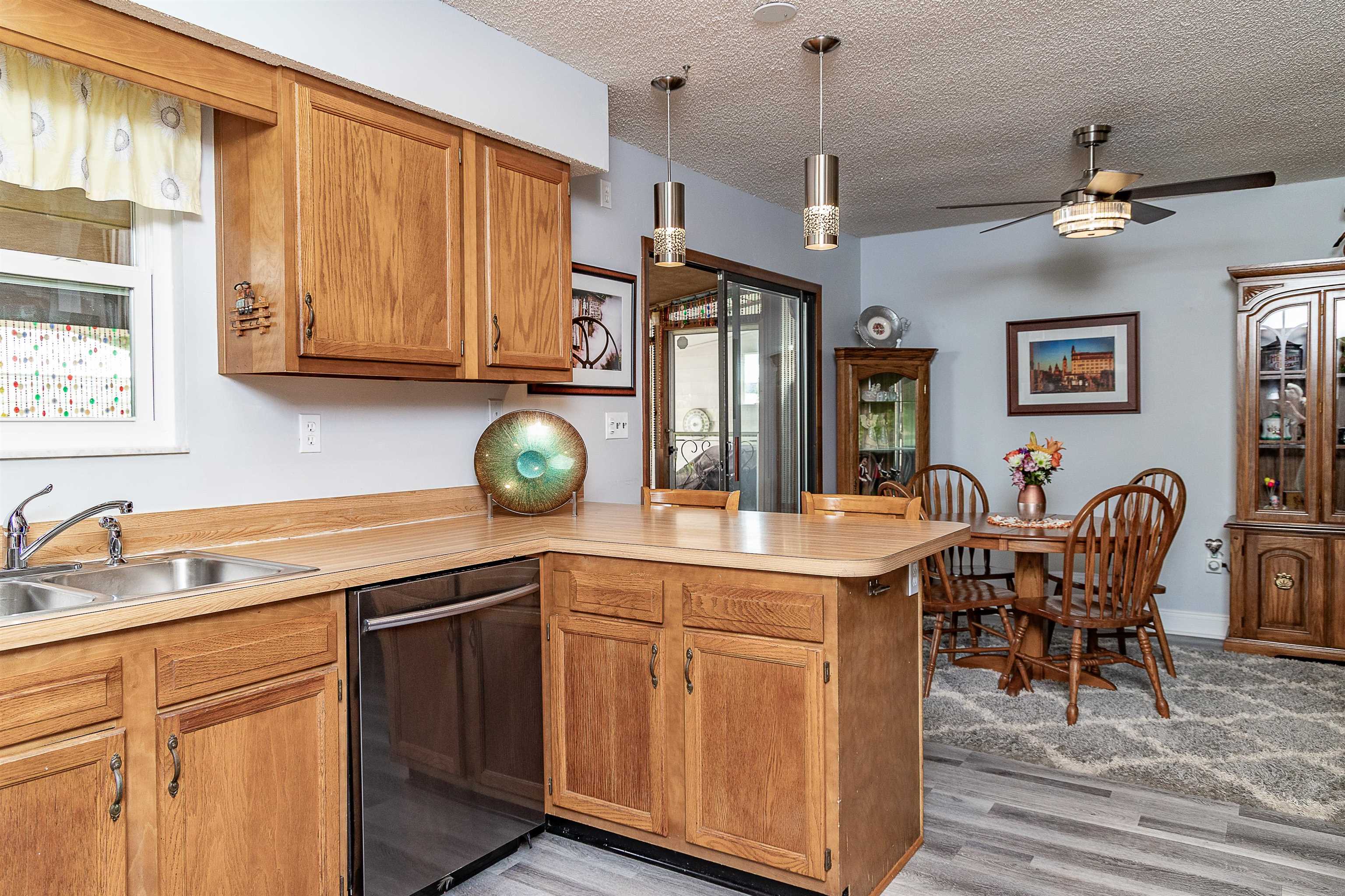 357 Orchis Road St. Augustine, FL 32086 - Photo 28 of 54 a kitchen with a sink a counter space appliances and cabinets