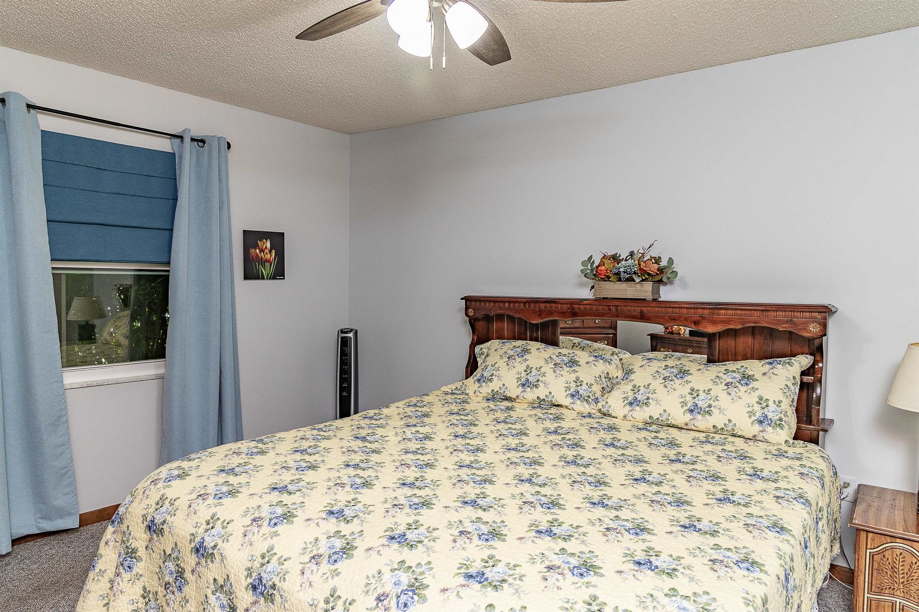 357 Orchis Road St. Augustine, FL 32086 - Photo 32 of 54 a bedroom with a bed and a chandelier