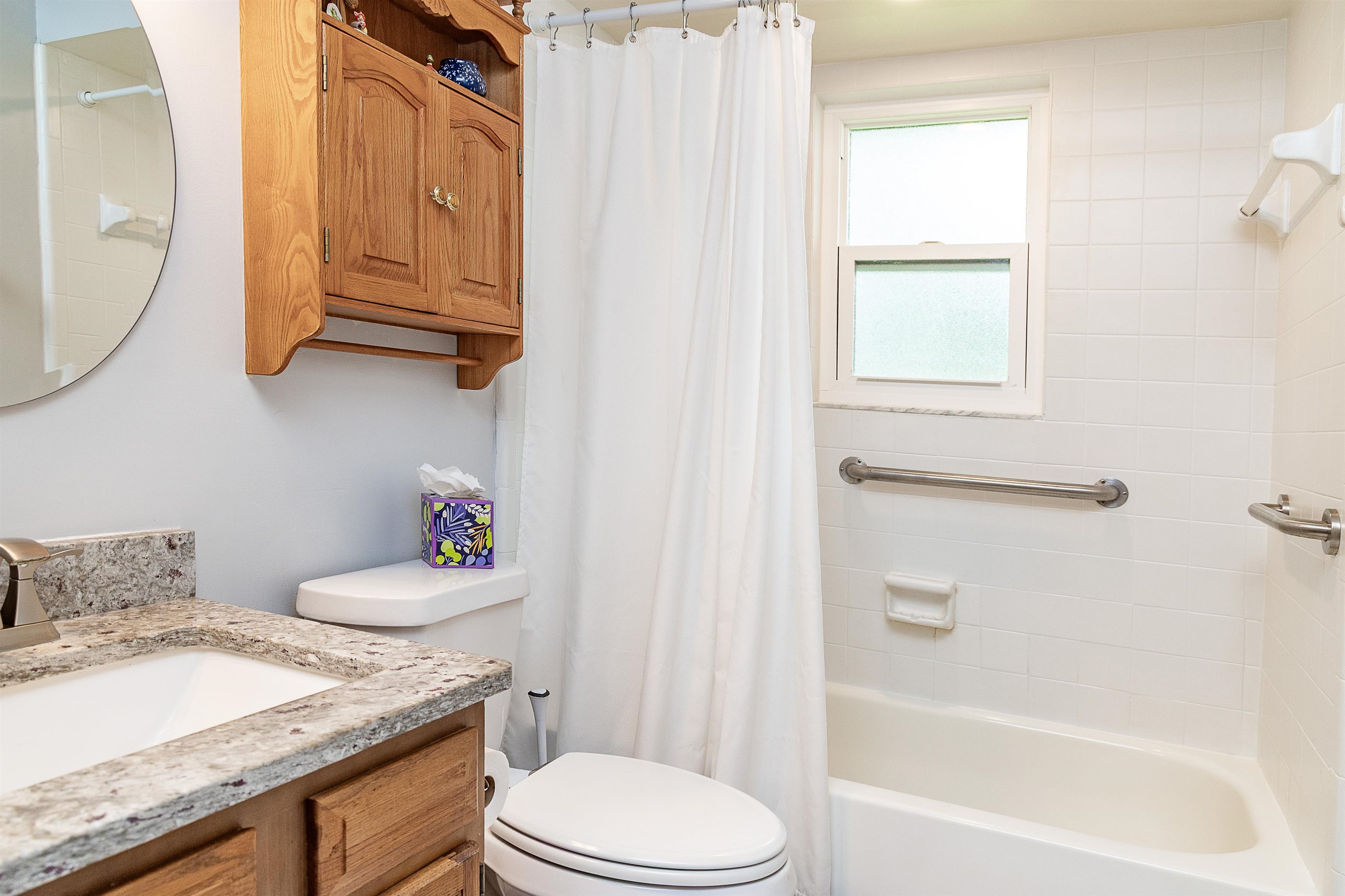 357 Orchis Road St. Augustine, FL 32086 - Photo 39 of 54 a bathroom with a granite countertop toilet sink and mirror