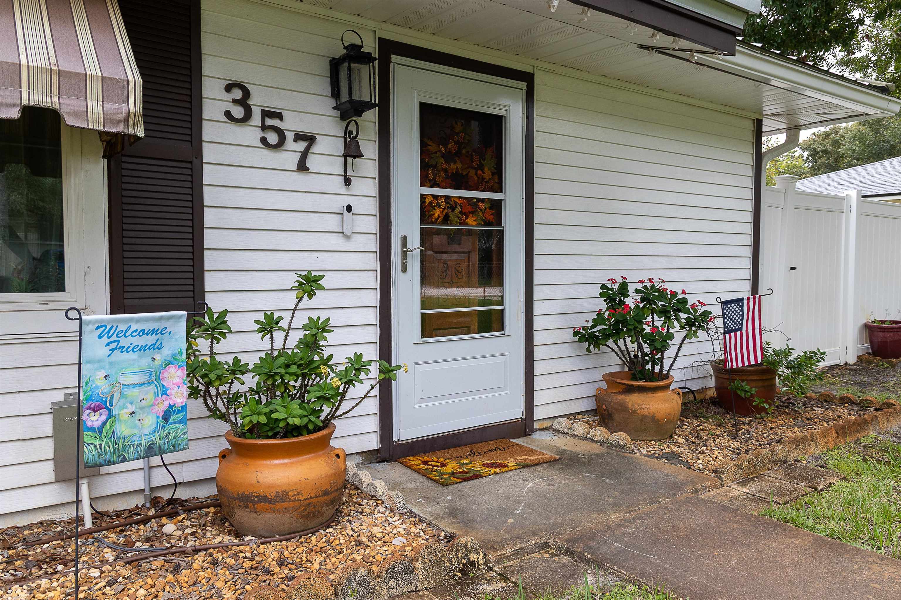 357 Orchis Road St. Augustine, FL 32086 - Photo 49 of 54 a potted plant sitting in front of a house