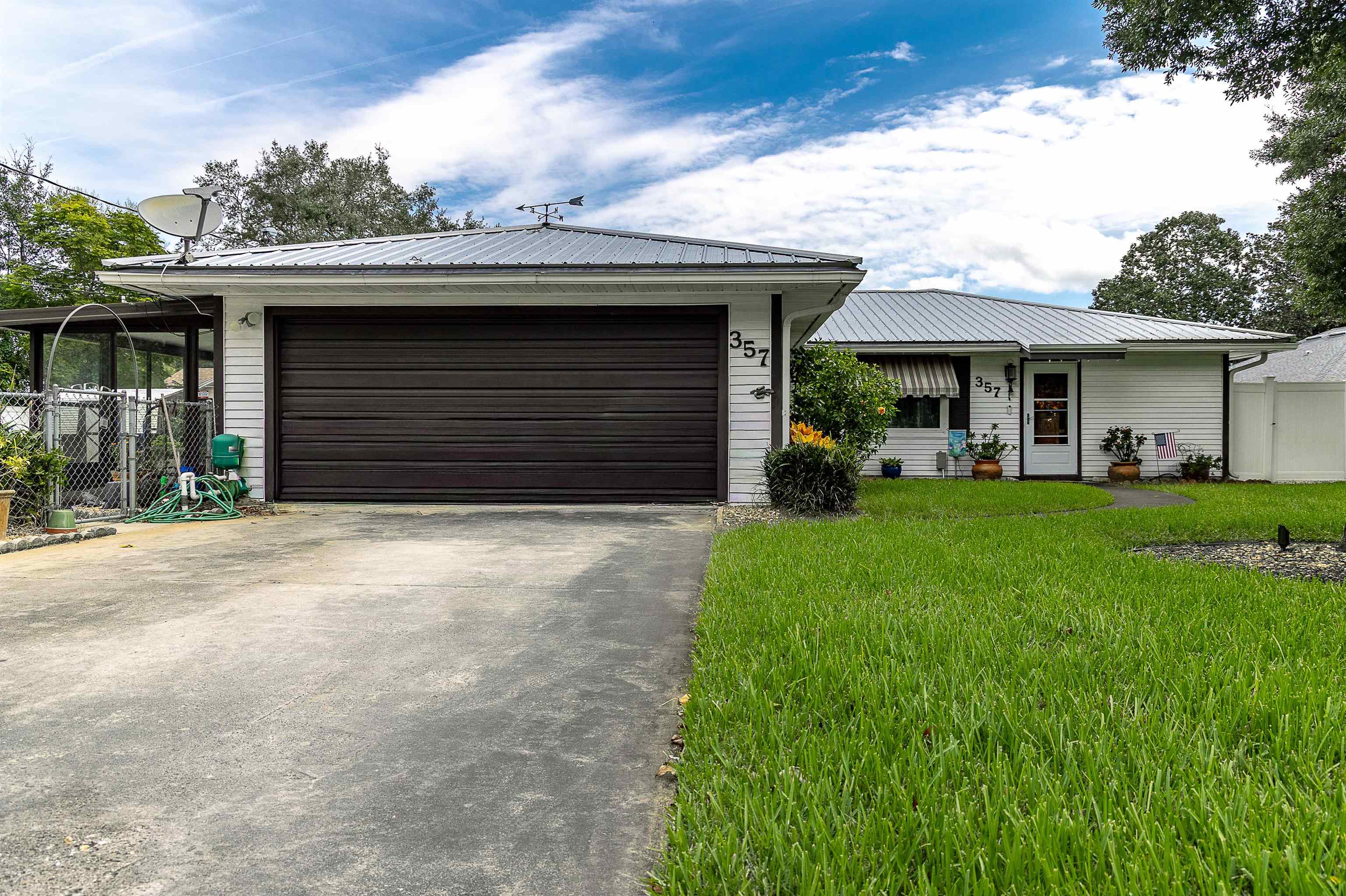 357 Orchis Road St. Augustine, FL 32086 - Photo 50 of 54 a house view with a garden space