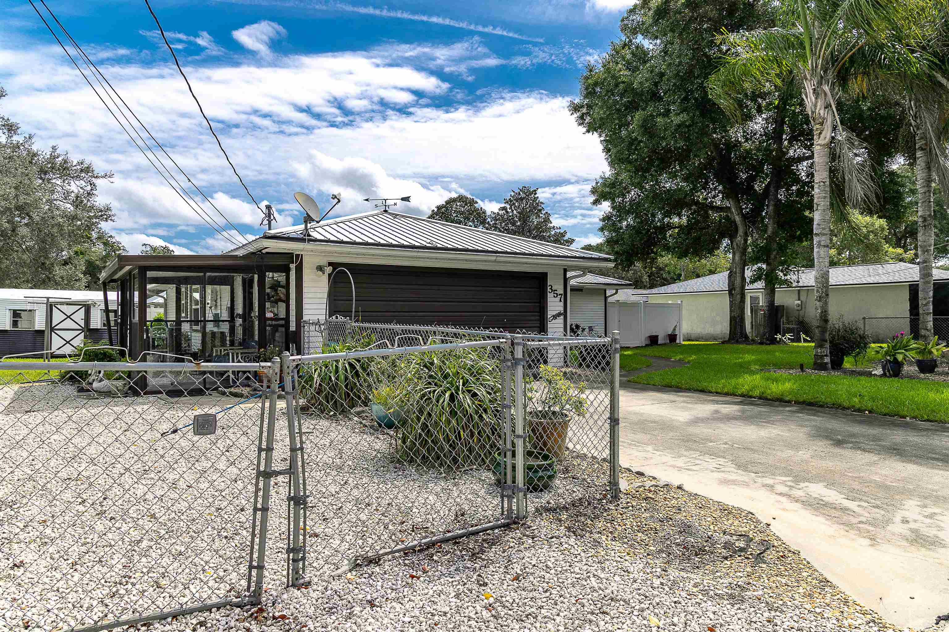 357 Orchis Road St. Augustine, FL 32086 - Photo 6 of 54 a view of a house with a yard and sitting area