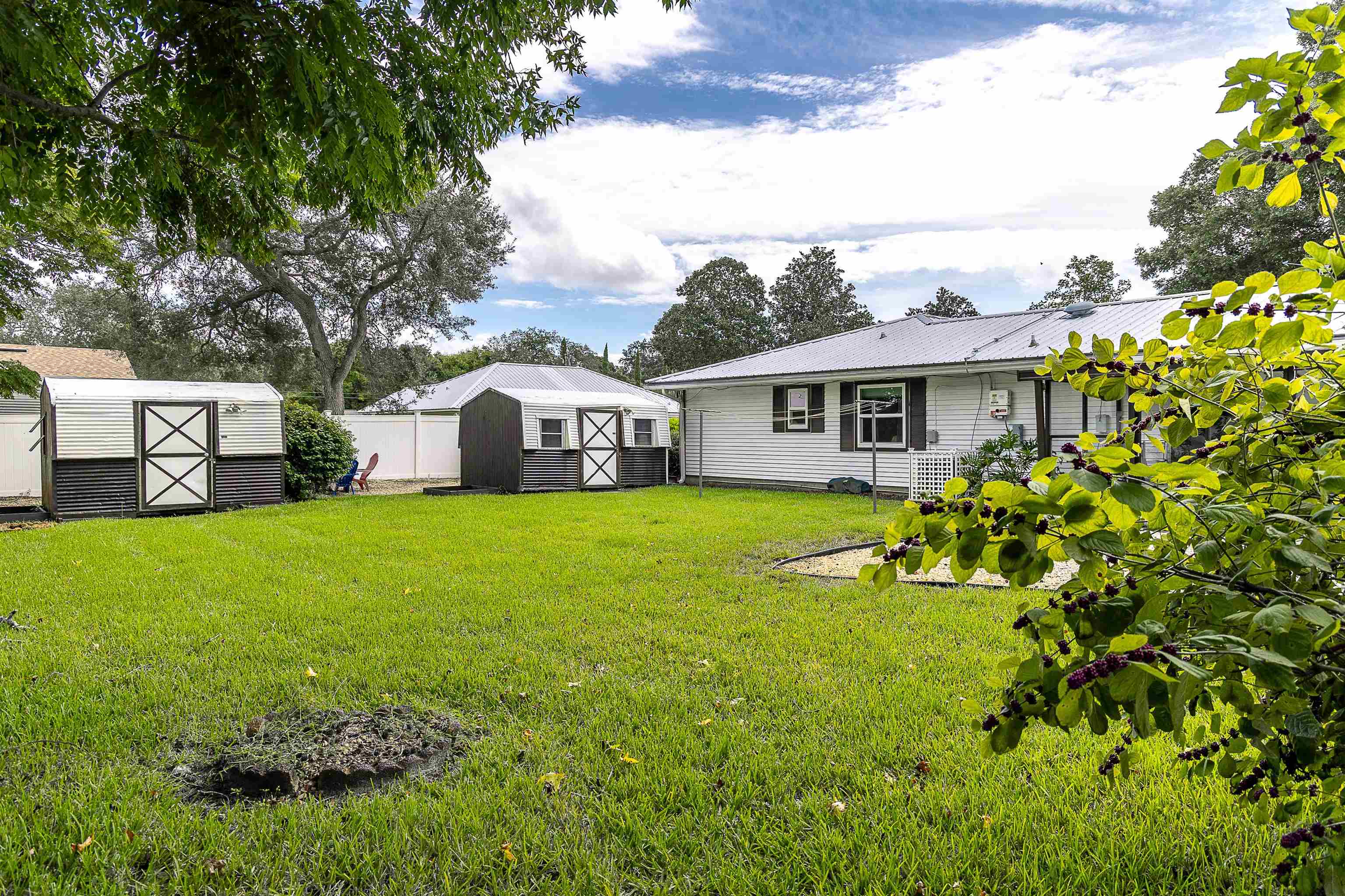 357 Orchis Road St. Augustine, FL 32086 - Photo 9 of 54 a front view of a house with garden
