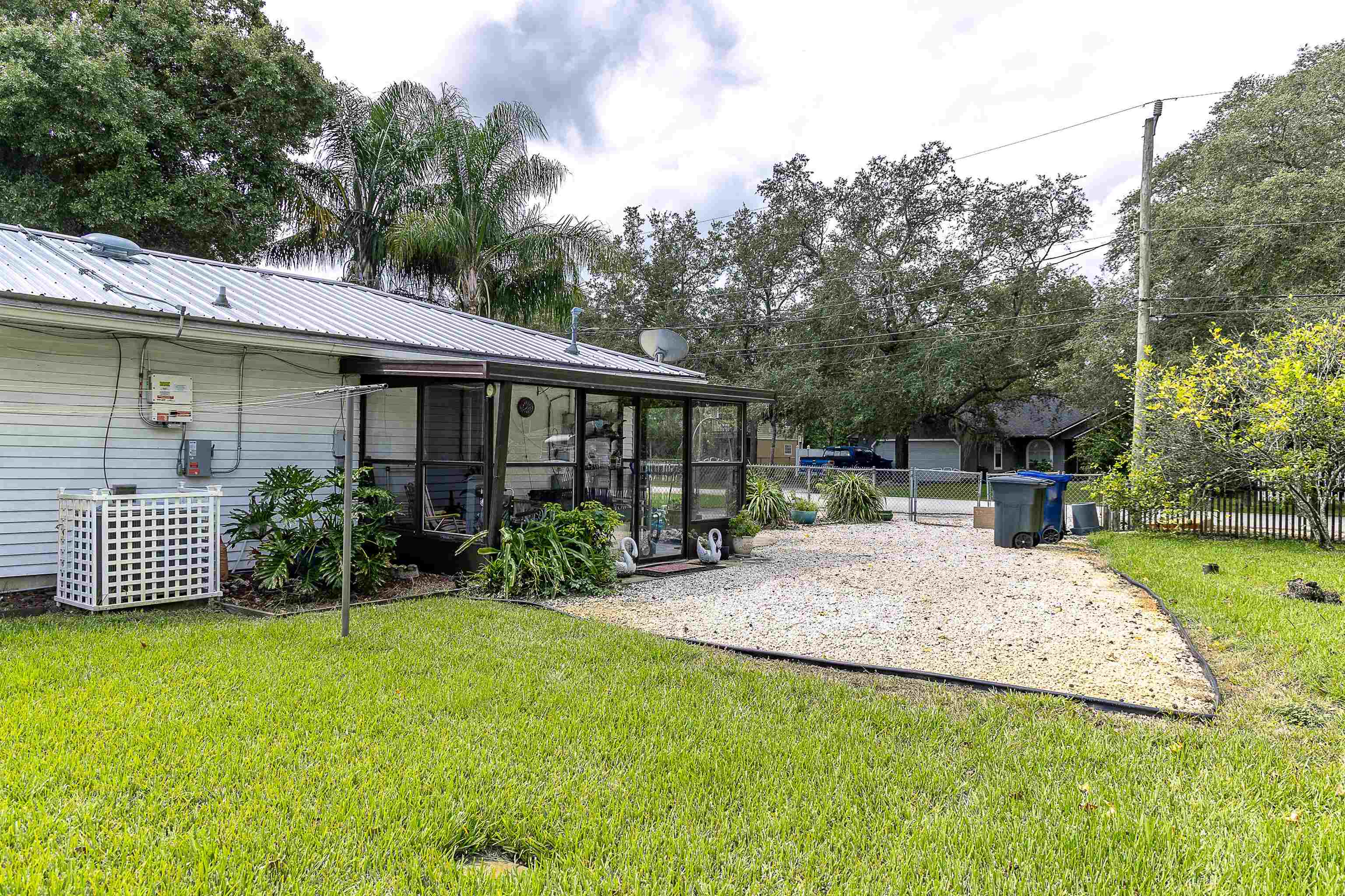 357 Orchis Road St. Augustine, FL 32086 - Photo 10 of 54 a view of a house with backyard porch and sitting area