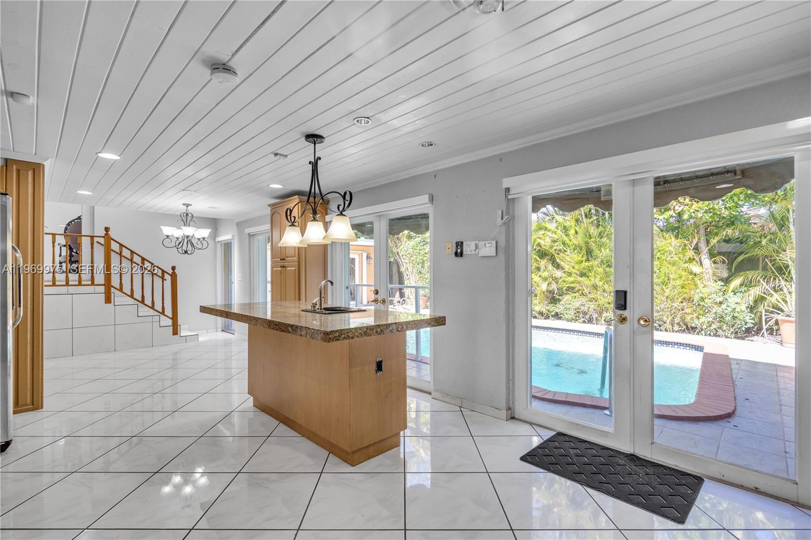 7941 Southwest 18th Terrace Miami, FL 33155 - Photo 16 of 60 a dining hall with granite countertop a large stove