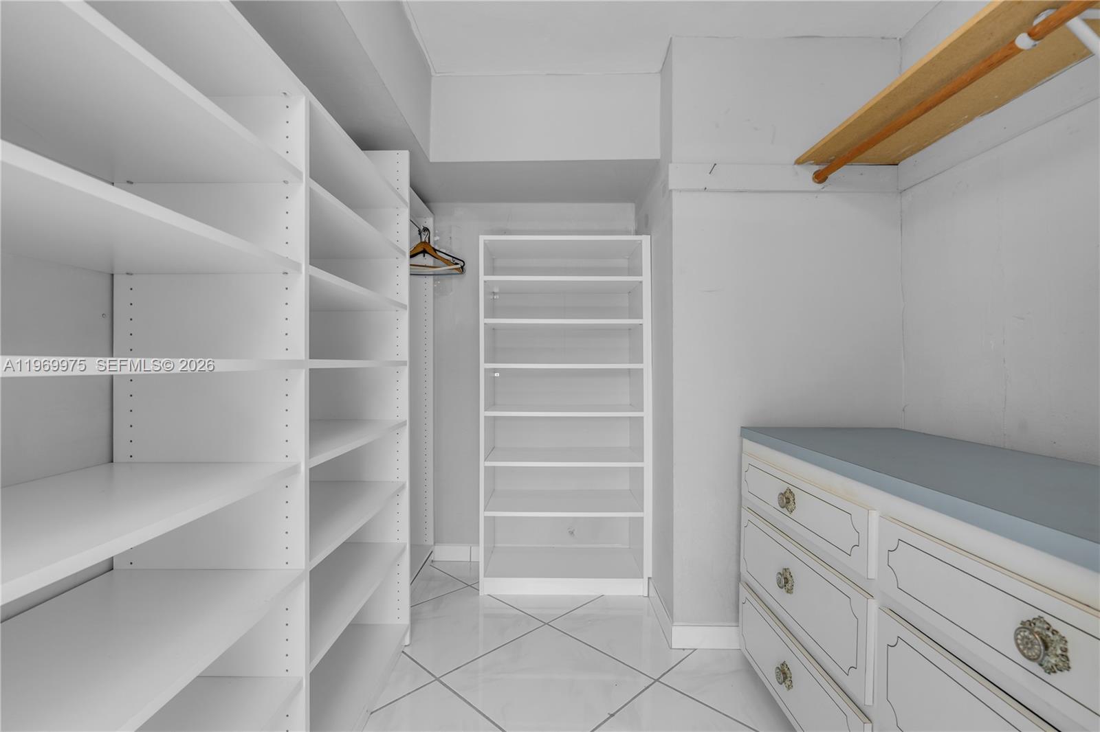 7941 Southwest 18th Terrace Miami, FL 33155 - Photo 28 of 60 a view of walk in closet with empty racks