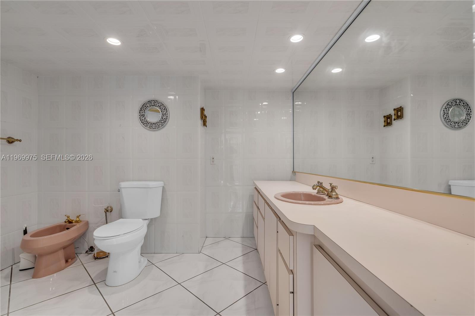 7941 Southwest 18th Terrace Miami, FL 33155 - Photo 29 of 60 a bathroom with a sink toilet and vanity