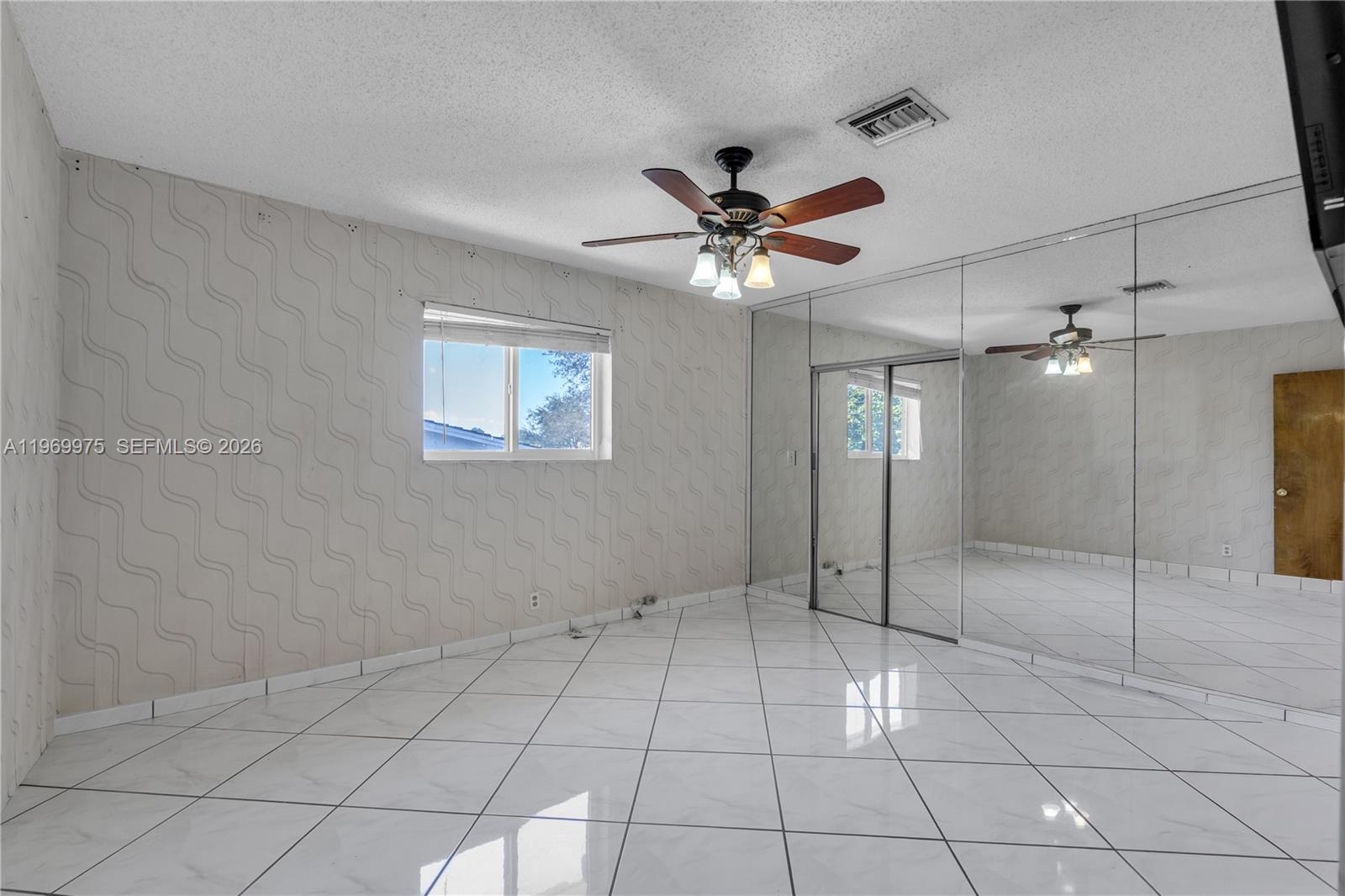 7941 Southwest 18th Terrace Miami, FL 33155 - Photo 34 of 60 a view of an empty room with a window