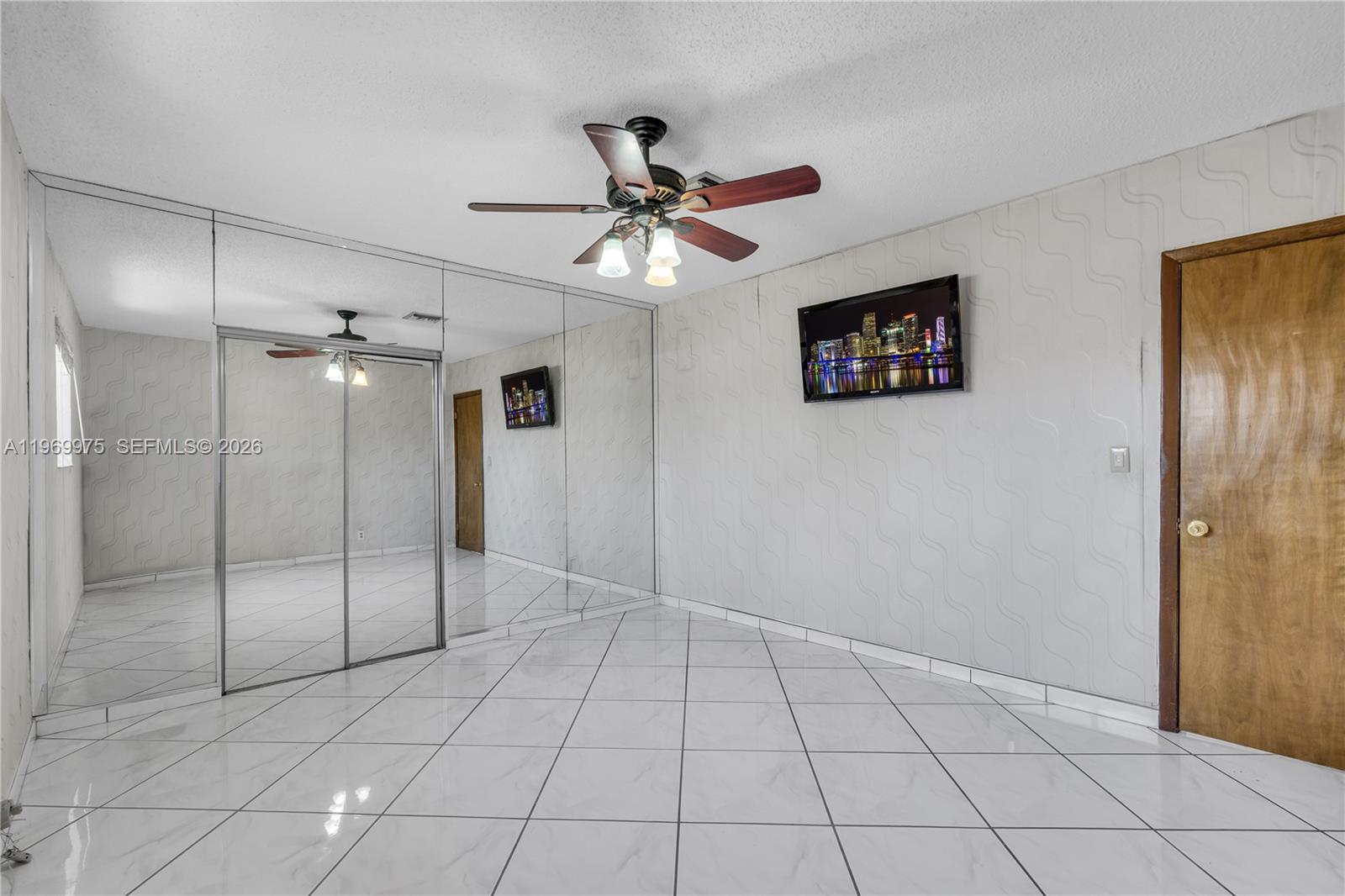 7941 Southwest 18th Terrace Miami, FL 33155 - Photo 35 of 60 a view of an empty room with a fan