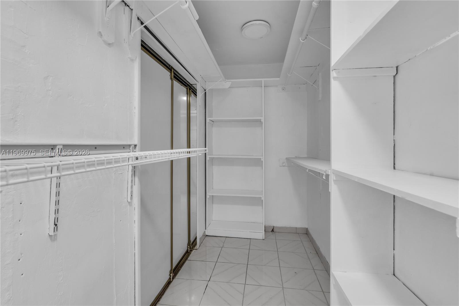 7941 Southwest 18th Terrace Miami, FL 33155 - Photo 38 of 60 a view of walk in closet with empty racks
