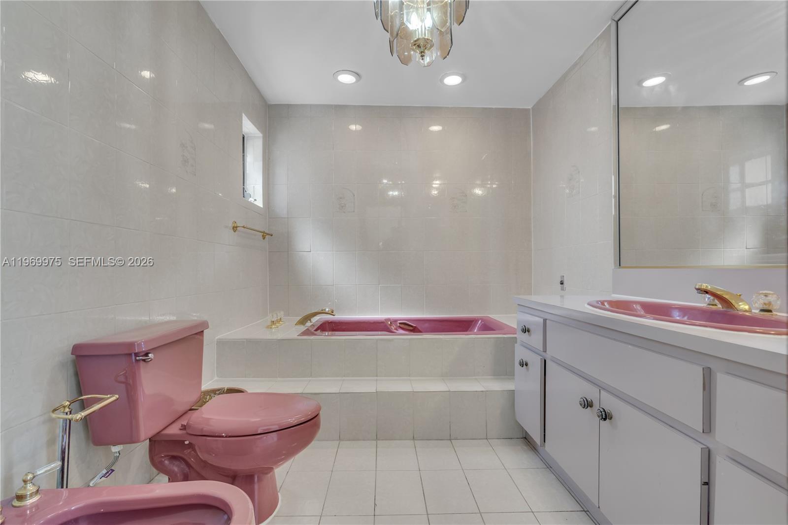 7941 Southwest 18th Terrace Miami, FL 33155 - Photo 40 of 60 a bathroom with a sink vanity mirror and toilet