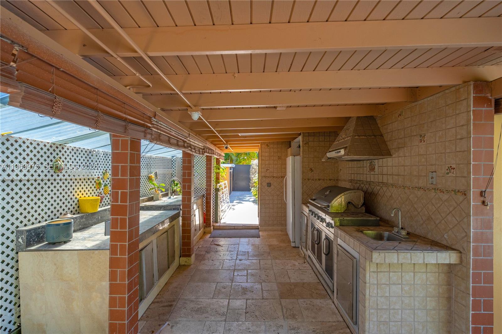 7941 Southwest 18th Terrace Miami, FL 33155 - Photo 47 of 60 Outdoor kitchen with built-in barbecue and sink.