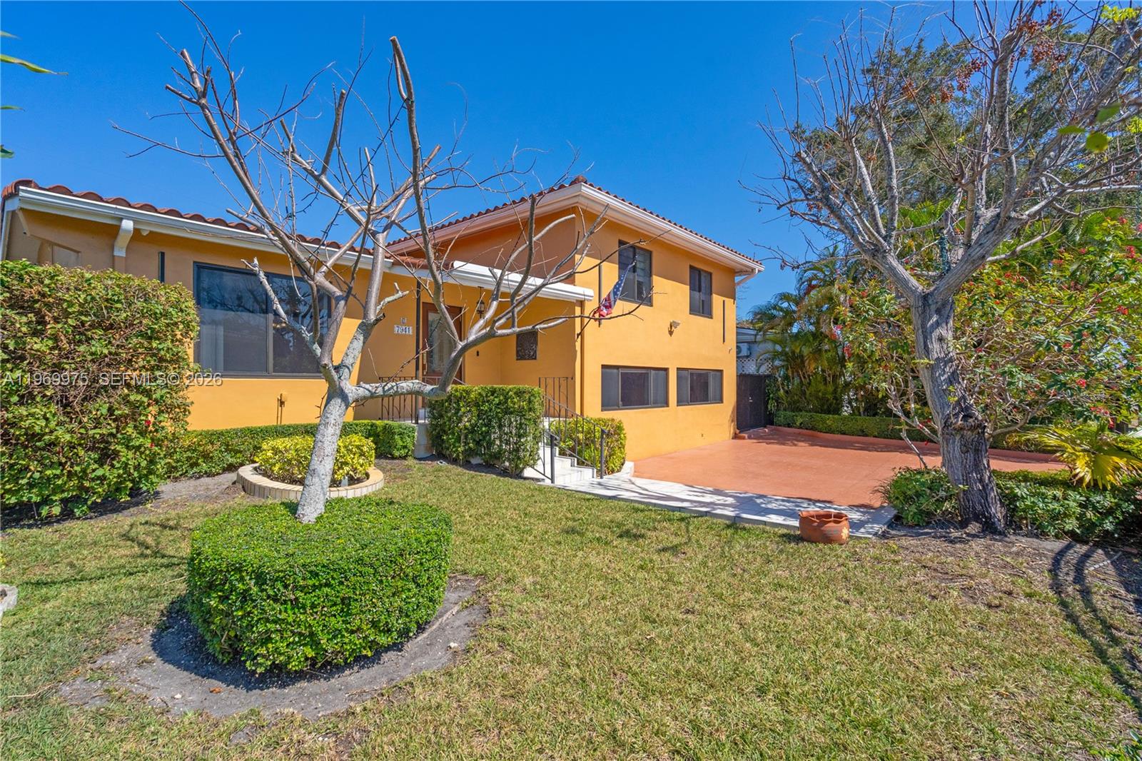 7941 Southwest 18th Terrace Miami, FL 33155 - Photo 5 of 60 a front view of a house with a yard