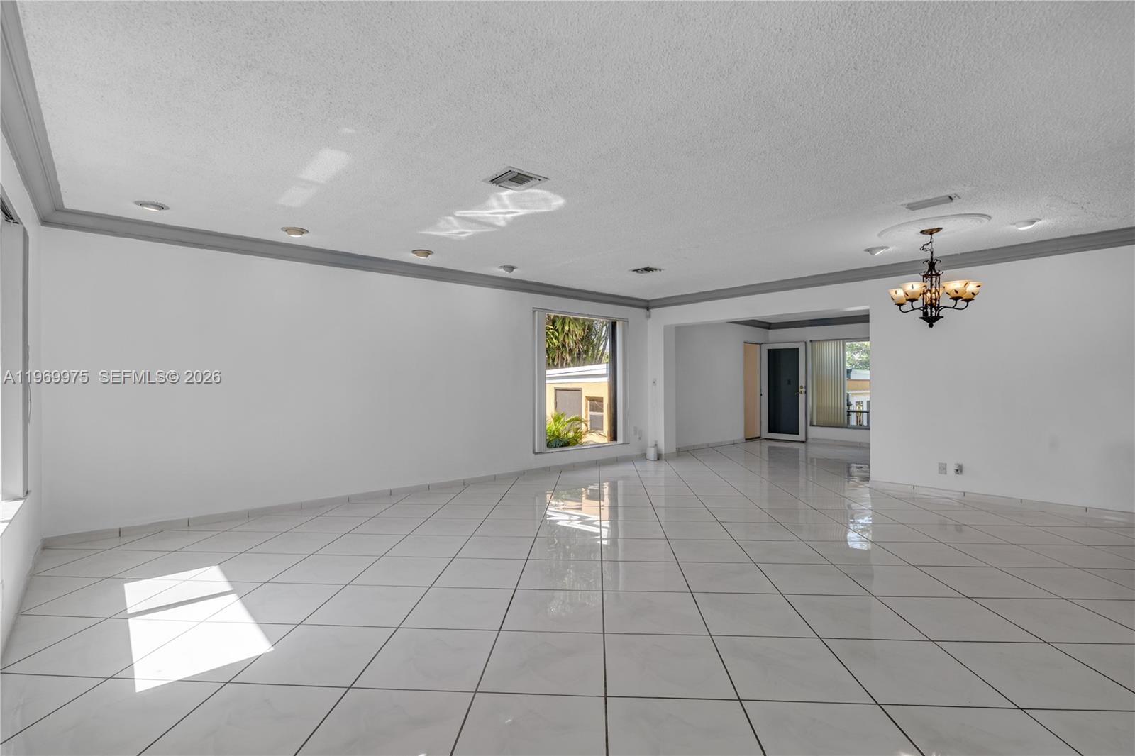 7941 Southwest 18th Terrace Miami, FL 33155 - Photo 7 of 60 a view of an empty room with a window