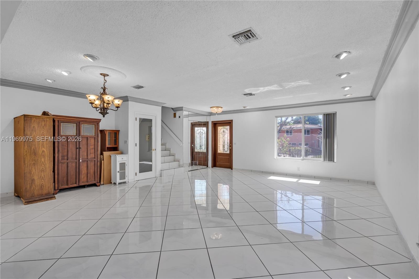 7941 Southwest 18th Terrace Miami, FL 33155 - Photo 10 of 60 a view of a hallway with chandelier