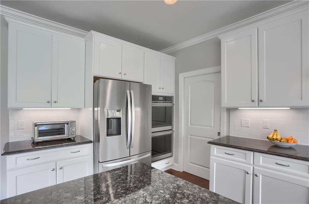 237 Tamarack Drive Gibsonia, PA 15044 - Photo 12 of 48 a kitchen with stainless steel appliances a refrigerator stove and cabinets