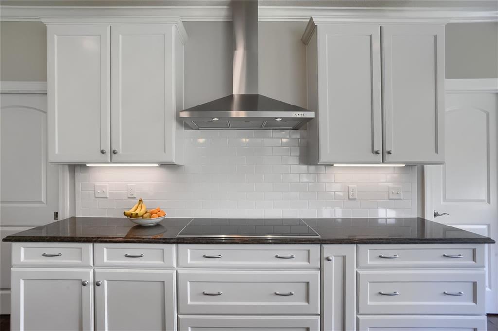 237 Tamarack Drive Gibsonia, PA 15044 - Photo 13 of 48 a kitchen with granite countertop white cabinets and white appliances