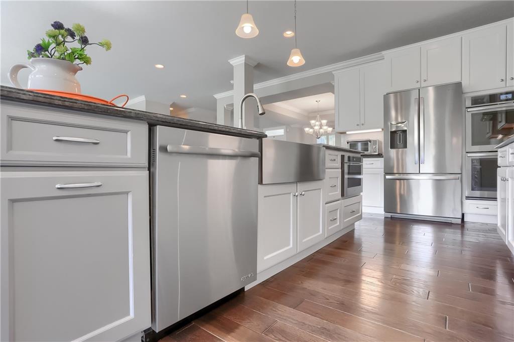 237 Tamarack Drive Gibsonia, PA 15044 - Photo 16 of 48 a kitchen with white cabinets and stainless steel appliances