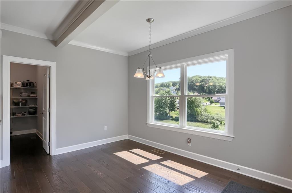 237 Tamarack Drive Gibsonia, PA 15044 - Photo 19 of 48 a view of a room with wooden floor and windows