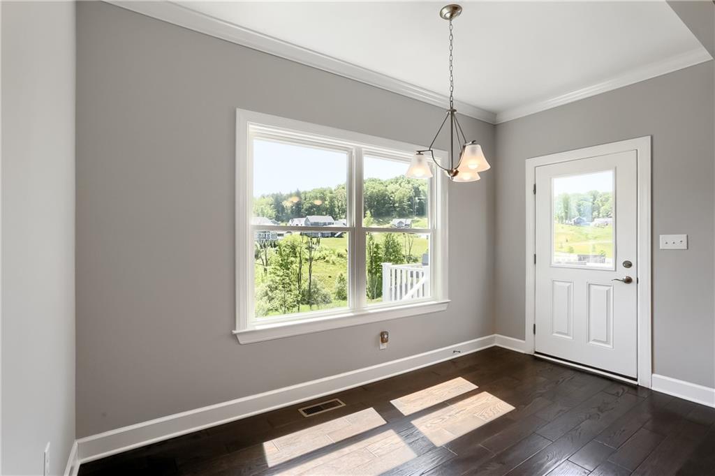 237 Tamarack Drive Gibsonia, PA 15044 - Photo 20 of 48 a view of a room with wooden floor and windows