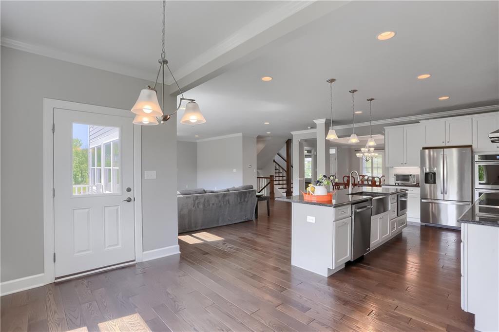 237 Tamarack Drive Gibsonia, PA 15044 - Photo 21 of 48 a kitchen with stainless steel appliances a stove top oven and refrigerator
