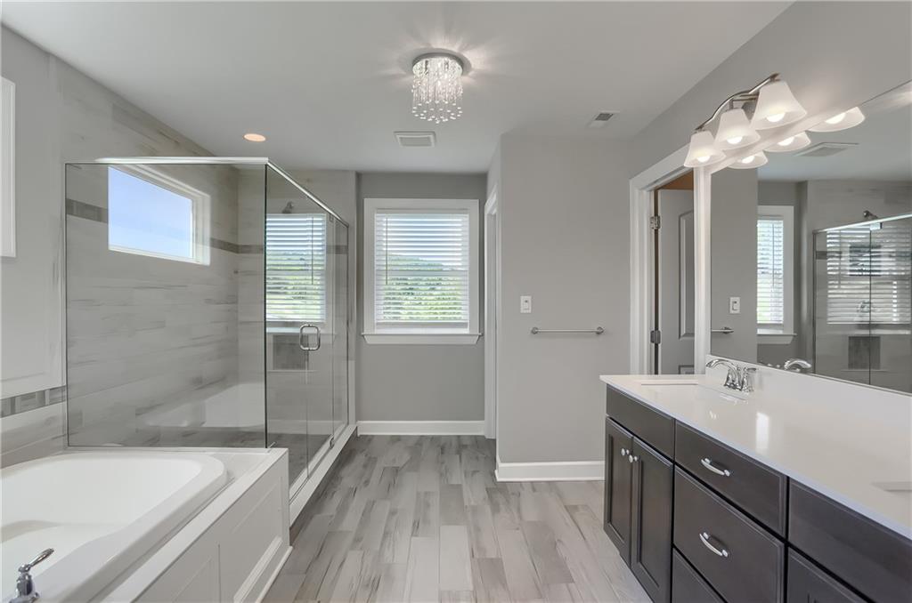 237 Tamarack Drive Gibsonia, PA 15044 - Photo 25 of 48 a spacious bathroom with a bathtub shower sink vanity and toilet