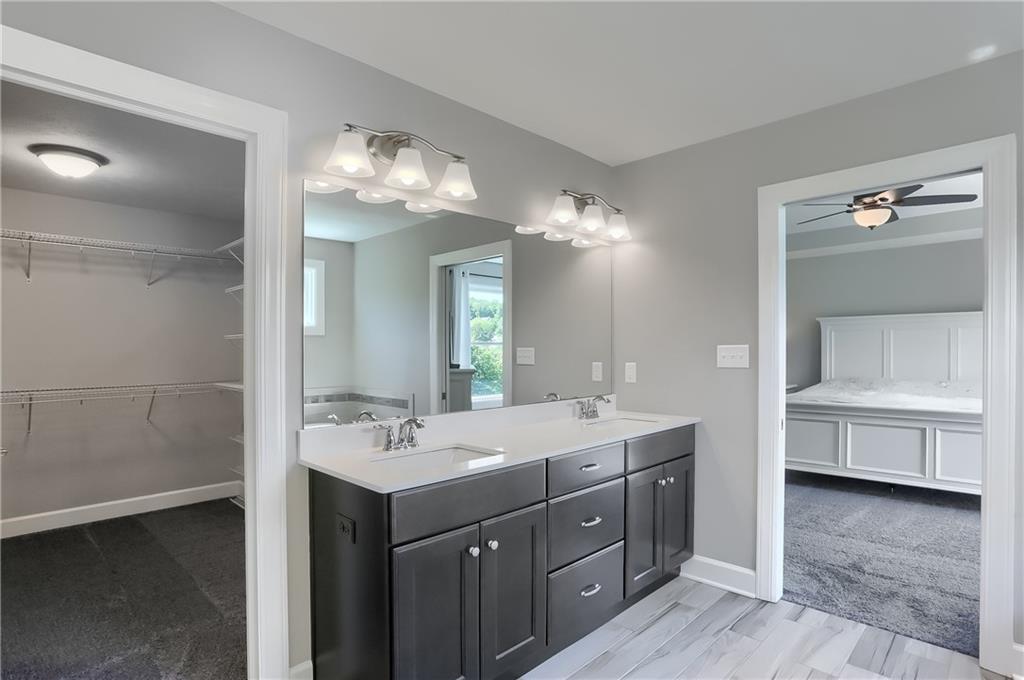 237 Tamarack Drive Gibsonia, PA 15044 - Photo 27 of 48 a bathroom with a double vanity sink mirror and bathtub