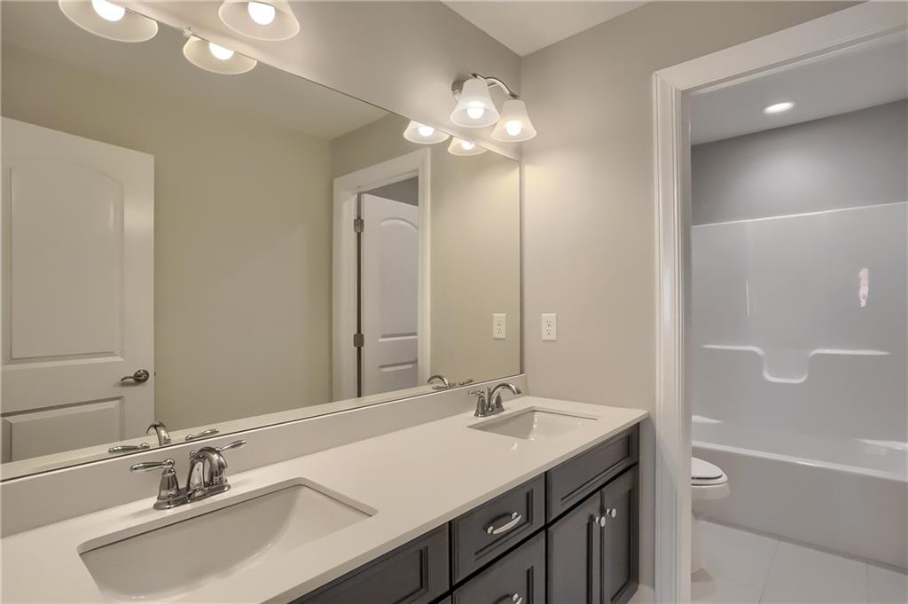 237 Tamarack Drive Gibsonia, PA 15044 - Photo 30 of 48 a bathroom with a sink double vanity and a mirror