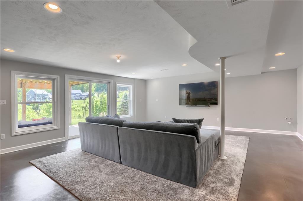 237 Tamarack Drive Gibsonia, PA 15044 - Photo 33 of 48 a living room with furniture and a flat screen tv