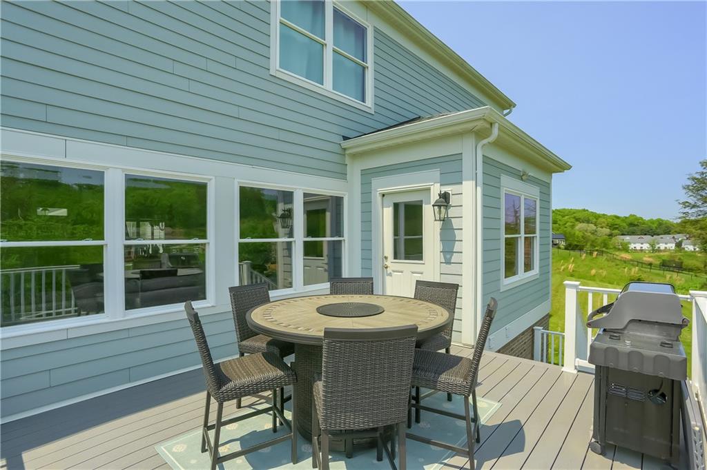 237 Tamarack Drive Gibsonia, PA 15044 - Photo 41 of 48 a view of a patio with table and chairs with wooden floor and fence