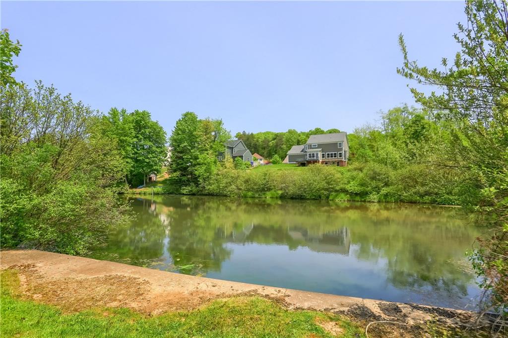 237 Tamarack Drive Gibsonia, PA 15044 - Photo 47 of 48 a view of a lake with a building in the background