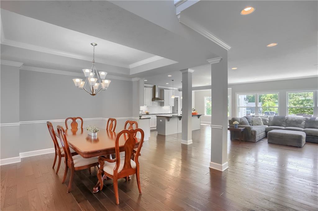 237 Tamarack Drive Gibsonia, PA 15044 - Photo 7 of 48 a view of a dining room with furniture wooden floor and chandelier