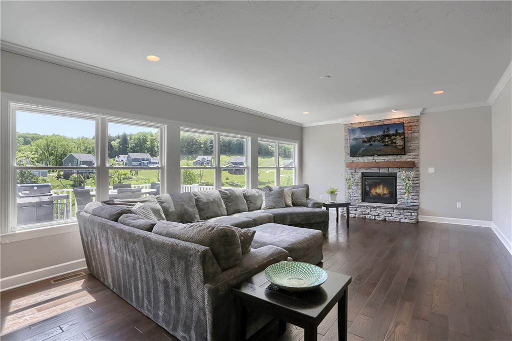237 Tamarack Drive Gibsonia, PA 15044 - Photo 8 of 48 a living room with furniture and a fireplace
