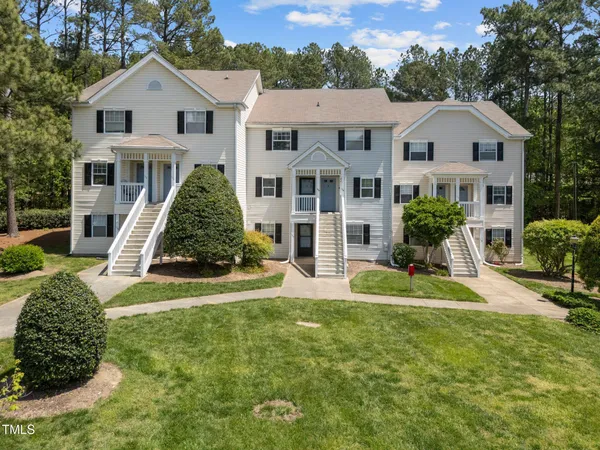 a view of a garden with a house